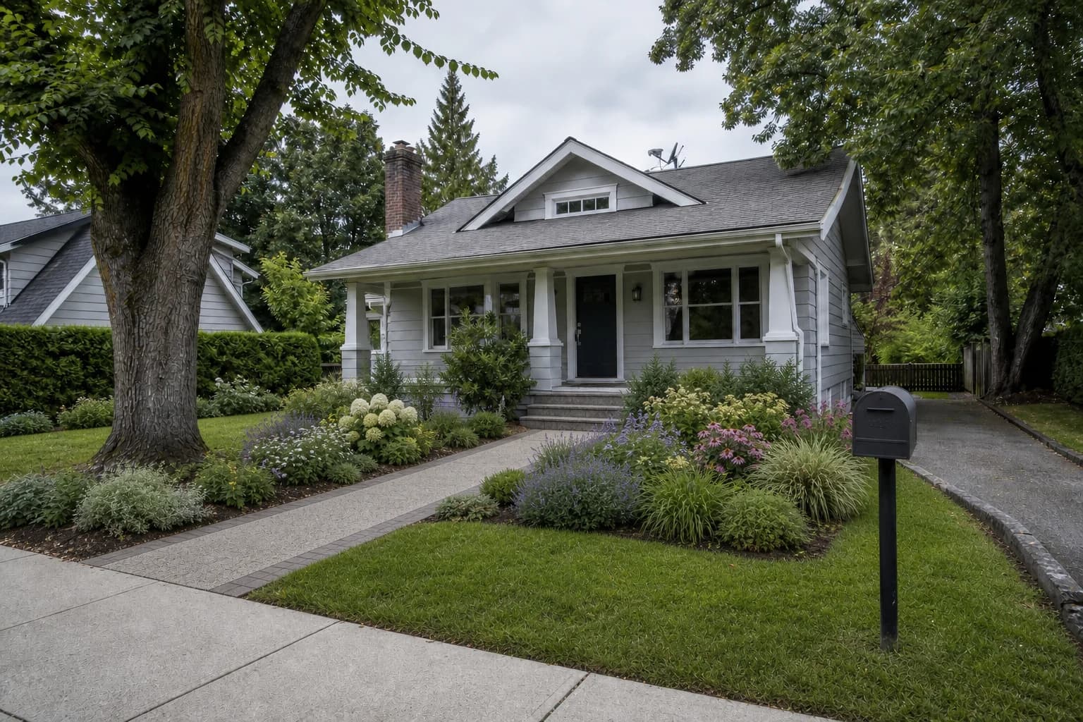Front yard design with planting, a pathway, and a welcoming entrance